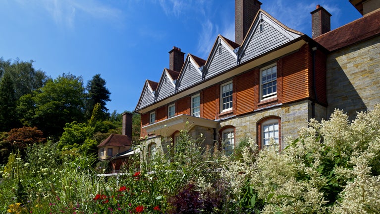 Standen in the summer with flowering herbaceous borders
